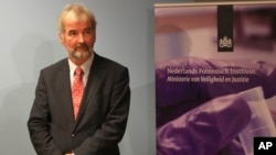 Wim Heijnen, head of medical forensic investigations at the Netherlands Forensic Institute, awaits the start of a press conference in The Hague, Netherlands, Aug. 27, 2014. 