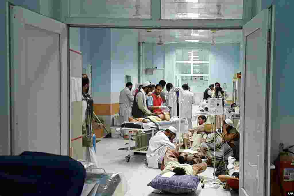In this undated photograph released by Doctors Without Borders (MSF) on Oct. 3, 2015, Afghan MSF medical personnel treat civilians injured following an offensive against Taliban militants by Afghan and coalition forces at the MSF hospital in Kunduz. An air strike on the hospital in Kunduz left three Doctors Without Borders staff dead and dozens more unaccounted for, the medical charity said, with NATO conceding U.S. forces may have been behind the bombing.