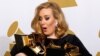 February 12, 2012: Singer Adele holds her six Grammy Awards at the 54th annual Grammy Awards in Los Angeles, California.