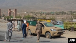 Security personnel examine the site of a blast after a suicide bomber on a motorbike blew himself up near a checkpoint in the southwestern city of Quetta, Sept. 5, 2021. 