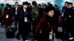 Members of the North Korean Olympic delegation arrive at the Olympic Village of the 2018 Winter Olympics in Gangneung, South Korea, Feb. 1, 2018. (AP Photo/Charlie Riedel)