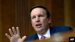 FILE - Democratic Senator Chris Murphy questions questions a witness during a hearing on Capitol Hill in Washington, July 25, 2018. 