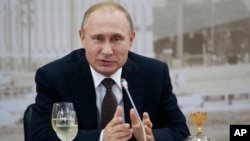 FILE - One political analyst says Russian President Vladimir Putin, pictured speaking at an economic forum in St. Petersburg in June 2016, is "nervous" about his grip on power.