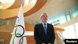 FILE - Thomas Bach, President of the International Olympic Committee (IOC), speaks in Lausanne, Switzerland, March 25, 2020.