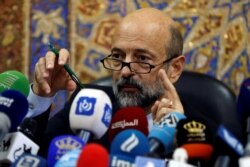 FILE - Jordan's Prime Minister Omar al-Razzaz speaks during a news conference in Amman, Jordan June 19, 2018.