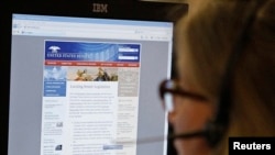 FILE - A journalist checks the U.S. Senate's website after it was attacked by hackers in Washington, June 13, 2011. 