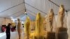 A worker stands next to the Oscar statues during a preparation work for the upcoming OSCARS, the 85th Academy Awards, at Hollywood Boulevard in Hollywood, California, February 19, 2013. 