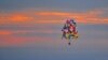 Jonathan Trappe is seen flying is cluster balloon ship on September 12, 2013. (Paul Cyr Barcroft media)