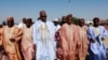 FILE - Nigerian presidential candidate Muhammadu Buhari, center, from the All Progressives Congress (APC) party arrives for a party rally in Maiduguri, Nigeria, February 2015. 