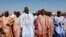 FILE - Nigerian presidential candidate Muhammadu Buhari, center, from the All Progressives Congress (APC) party arrives for a party rally in Maiduguri, Nigeria, February 2015. 