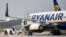 FILE - A Ryanair plane parks at the airport in Weeze, Germany, Sept. 12, 2018. 