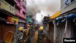 Security personnel patrols on a street after violence erupted between police and protestors over a comment on Prophet Mohammed by Bharatiya Janata Party (BJP) member Nupur Sharma, in Howrah on the outskirts of Kolkata, India, June 11, 2022. 