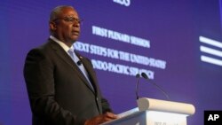 FILE - U.S. Defense Secretary Lloyd Austin speaks at the 19th International Institute for Strategic Studies Shangri-la Dialogue, in Singapore, June 11, 2022. Austin contracted COVID-19 for the second time this year and has mild symptoms.