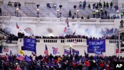 FILE - Supporters of President Donald Trump storm the Capitol, Jan. 6, 2021, in Washington.