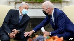 FILE - President Joe Biden (right) meets with Mexican President Andrés Manuel López Obrador at the White House, Nov. 18, 2021. The Summit of the Americas begins June 8, 2022, in Los Angeles and López Obrador plans to skip it because Cuba, Venezuela and Nicaragua aren't included.