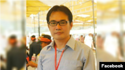 Oeur Narith, a former opposition (CNRP) official and parliamentary aide, posed for a photo at a ceremony in Phnom Penh, Cambodia. (Courtesy of Facebook) 