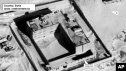 This image provided by the State Department and DigitalGlobe, taken Jan. 15, 2015, a satellite image of what the State Department described as a building in a prison complex in Syria that was modified to support a crematorium. 