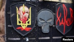 Ukrainian servicemen return from heavy fighting near Bakhmut