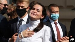 Belarusian opposition leader Sviatlana Tsikhanouskaya interacts with supporters in Warsaw, Poland, Sept. 9, 2020. 