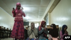 FILE - Orphans pray during a celebration of Eid al-Fitr, the Muslim holiday marking the end of Ramadan, at Mama Fatuma Goodwill Children's Home in Nairobi, Kenya, on May 25, 2020.