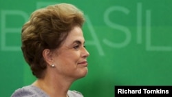 Brazil's President Dilma Rousseff smiles as she attends a meeting with jurists at Planalto Palace in Brasilia, Brazil, March 22, 2016. 