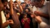 Son of the late Ammar Badie prays during his father's funeral in al-Hamed mosque in Cairo's Katameya district on Aug. 18, 2013. Badie, the son of Muslim Brotherhood's spiritual leader Mohammed Badie, was killed by Egyptian security forces Friday.