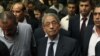 Egyptian presidential candidate Amr Moussa, center, attends a news conference in Cairo, May 16, 2012.