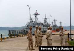 Sailors stand guard near petrol boats at the Cambodian Ream Naval Base, July 26, 2019. (Samrang Pring/Reuters)