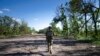 A Ukrainian serviceman changes his position at the front line near Kharkiv, Ukraine, on July 2, 2022.