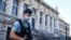 FILE - A French Gendarme patrols outside Paris' courthouse ahead of the start of the trial of the Nov. 13, 2015 Paris attacks' defendants. proceedings. 