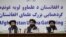 FILE - Taliban spokesman Zabihullah Mujahid, center, speaks during a press conference in Kabul on June 30, 2022.