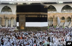 Thousands of Muslim pilgrims circumambulate around the Kaaba, the cubic building at the Grand Mosque, in the Saudi Arabia's holy city of Mecca, Tuesday, July 5, 2022. (AP Photo/Amr Nabil)