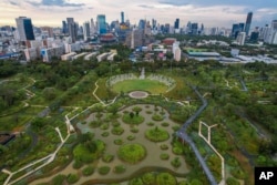 An aerail view shows the water features of Benjakitti Park in Bangkok, Thailand, Sunday, May 8, 2022. (AP Photo/Krit Phromsakla Na Sakolnakorn)