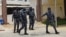 ARCHIVES - Des policiers à Cotonou, au Bénin, le 12 avril 2021.