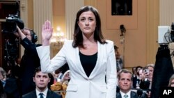Cassidy Hutchinson, former aide to Trump White House chief of staff Mark Meadows, is sworn in to testify as the House select committee investigating the Jan. 6 attack on the U.S. Capitol holds a hearing at the Capitol in Washington, June 28, 2022. (AP Photo/Andrew Harnik, Pool)