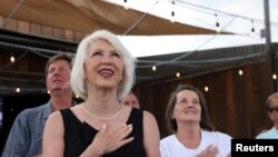 Tina Peters sings the National Anthem at her primary election night rally in Sedalia, Colorado, June 28, 2022.