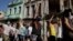 FILE - Protesters shout slogans against the government during a demonstration, which also involved counter-protesters who are in support of the government, in Havana, Cuba July 11, 2021. 