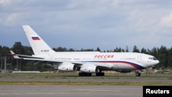 FILE - A Ilyushin Il-96-300 plane carrying Russia's President Vladimir Putin arrives at the Helsinki-Vantaa Airport in Vantaa, Finland, Aug. 21, 2019. 