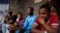 File -The family of Theresa Ogbu, 51, who was a victim of the attack by gunmen on worshippers during a Sunday mass service, attend an interview with Reuters at their home in Owo, Ondo, Nigeria, June 7, 2022. 