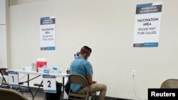 A man receives a dose of the Jynneos monkeypox vaccine as part of DC Health's first vaccination drive in Washington, June 28, 2022.