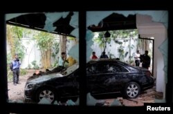 A part of the private residence of the Prime Minister Ranil Wickremesinghe is seen after demonstrators burnt it during the protest, amid the country's economic crisis, in Colombo, Sri Lanka July 10, 2022. (REUTERS/Dinuka Liyanawatte)