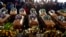 A view of some of the coffins during a funeral in Scenery Park, East London, South Africa, July 6, 2022. The service was for 21 teens who died in a mysterious tragedy at a nightclub nearly two weeks ago.