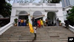 Protesters gather in and around the premisses of prime minister's official residence a day after it was stormed in Colombo, Sri Lanka, July 10, 2022. 