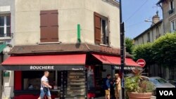 Sunday shopping in Neuilly Plaisance, another errand along with voting, June 19, 2022. (Lisa Bryant/VOA)
