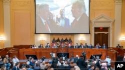 A image of former President Donald Trump talking to his Chief of Staff Mark Meadows is seen as Cassidy Hutchinson, former aide to Trump White House chief of staff Mark Meadows, testifies at the Capitol in Washington, June 28, 2022.
