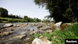 Italy's historic River Tiber is seen with low water levels near Ponte Milvio, in Rome, June 21, 2022.