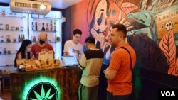 Customers visit the Sensii cannabis dispensary in Bangkok. (Peter Zsombor/VOA)