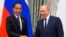 Russian President Vladimir Putin, right, and Indonesian President Joko Widodo shake hands after a joint news conference after their meeting in the Kremlin in Moscow, June 30, 2022.
