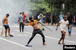 FILE - Police use tear gas to disperse protesters demanding President Gotabaya Rajapaksa step down, amid the country's ongoing economic crisis, in Colombo, Sri Lanka, May 29, 2022.