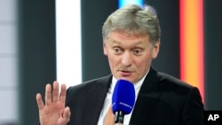 FILE - Kremlin spokesman Dmitry Peskov speaks to journalists in Moscow, Russia, on Dec. 23, 2021.